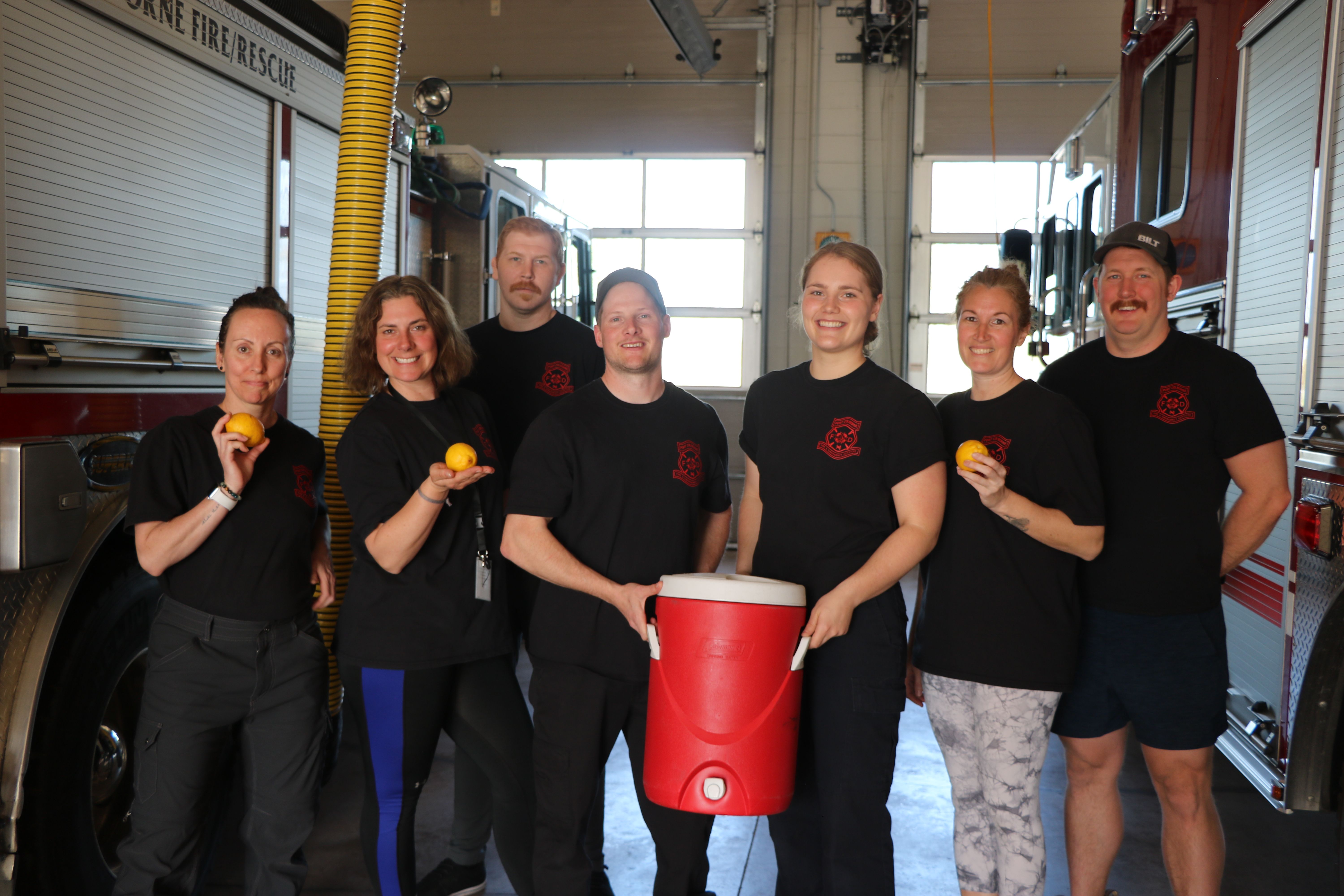 Fire Recruits holding lemonade